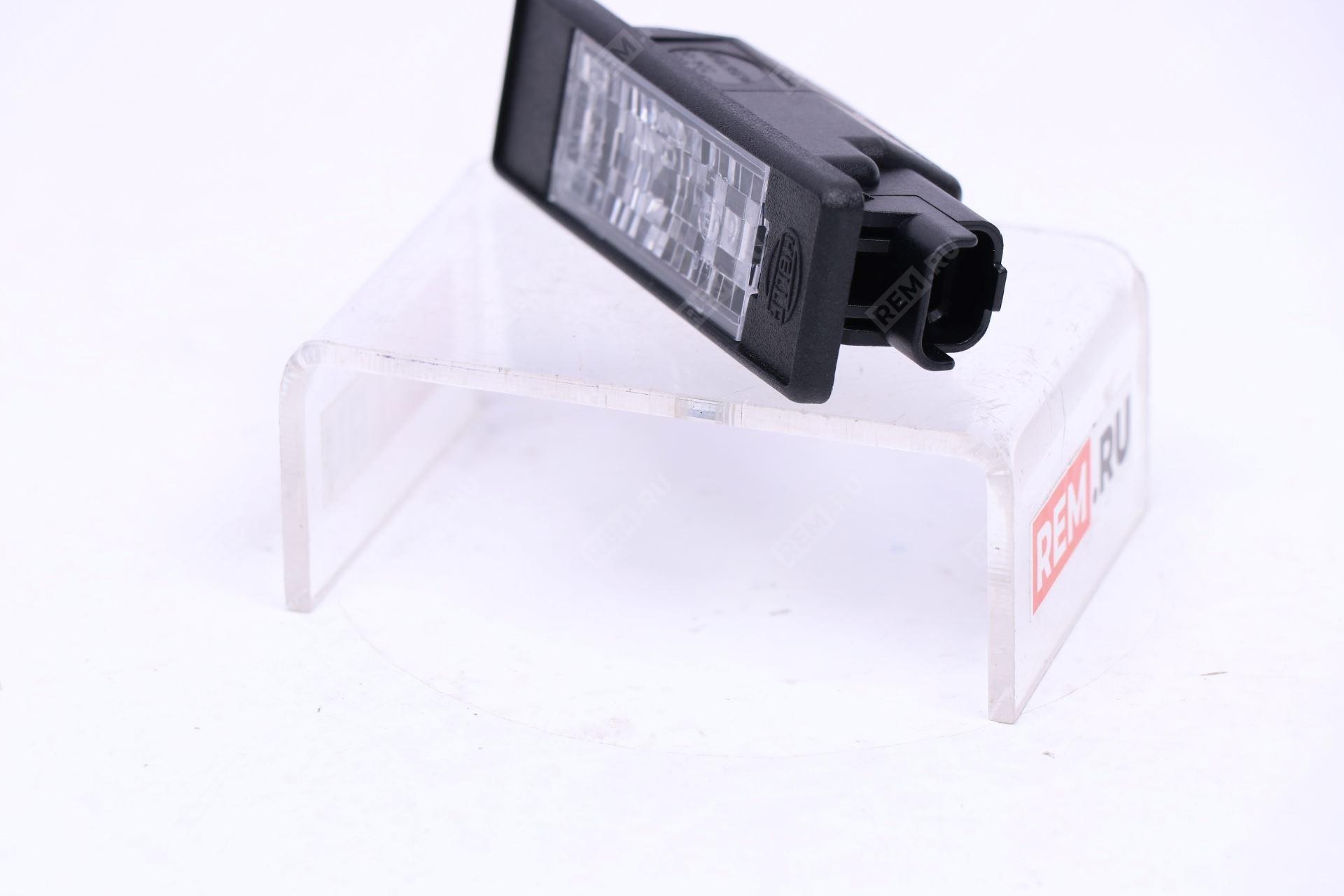 Фонарь подсветки номерного знака Nissan 26510AU300 фонарь подсветки номерного знака (фото 2)